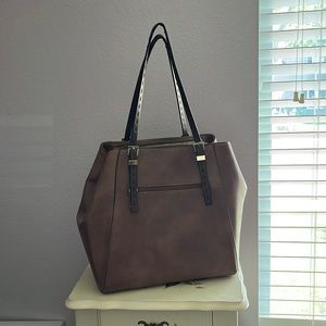 A brown tote bag with decent straps to hold on your shoulder/arm good condition